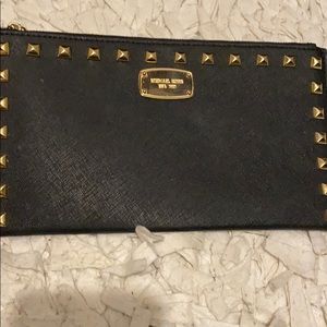 Black Michael Kors wristlet with gold studs